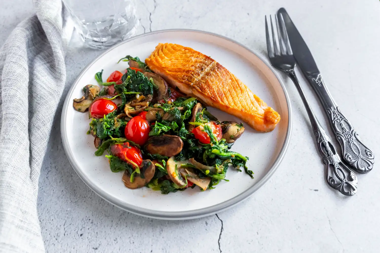 Healthy salmon meal with sautéed vegetables representing a balanced medical weight loss lifestyle.