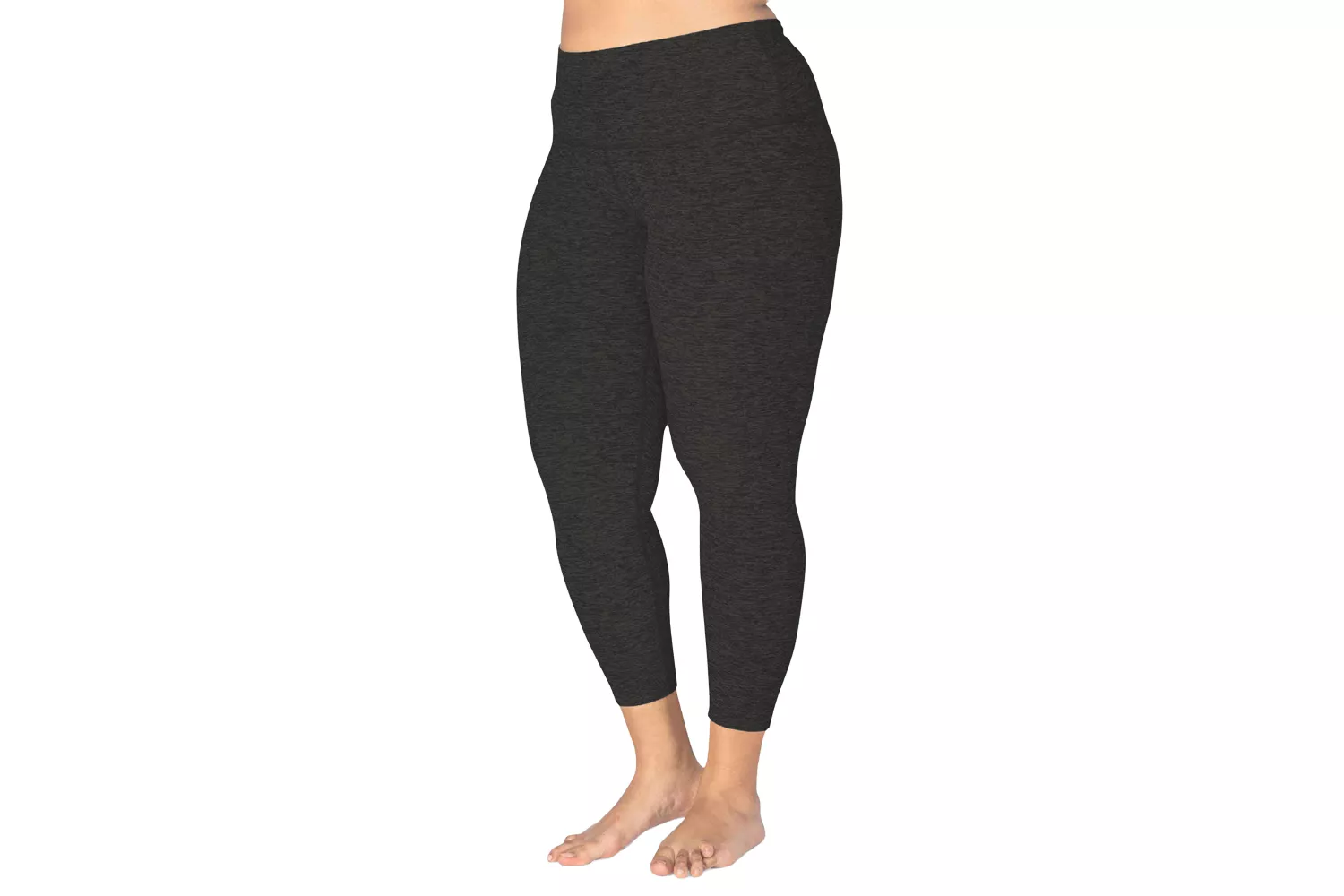 A person modeling dark heathered high-waisted capri leggings.