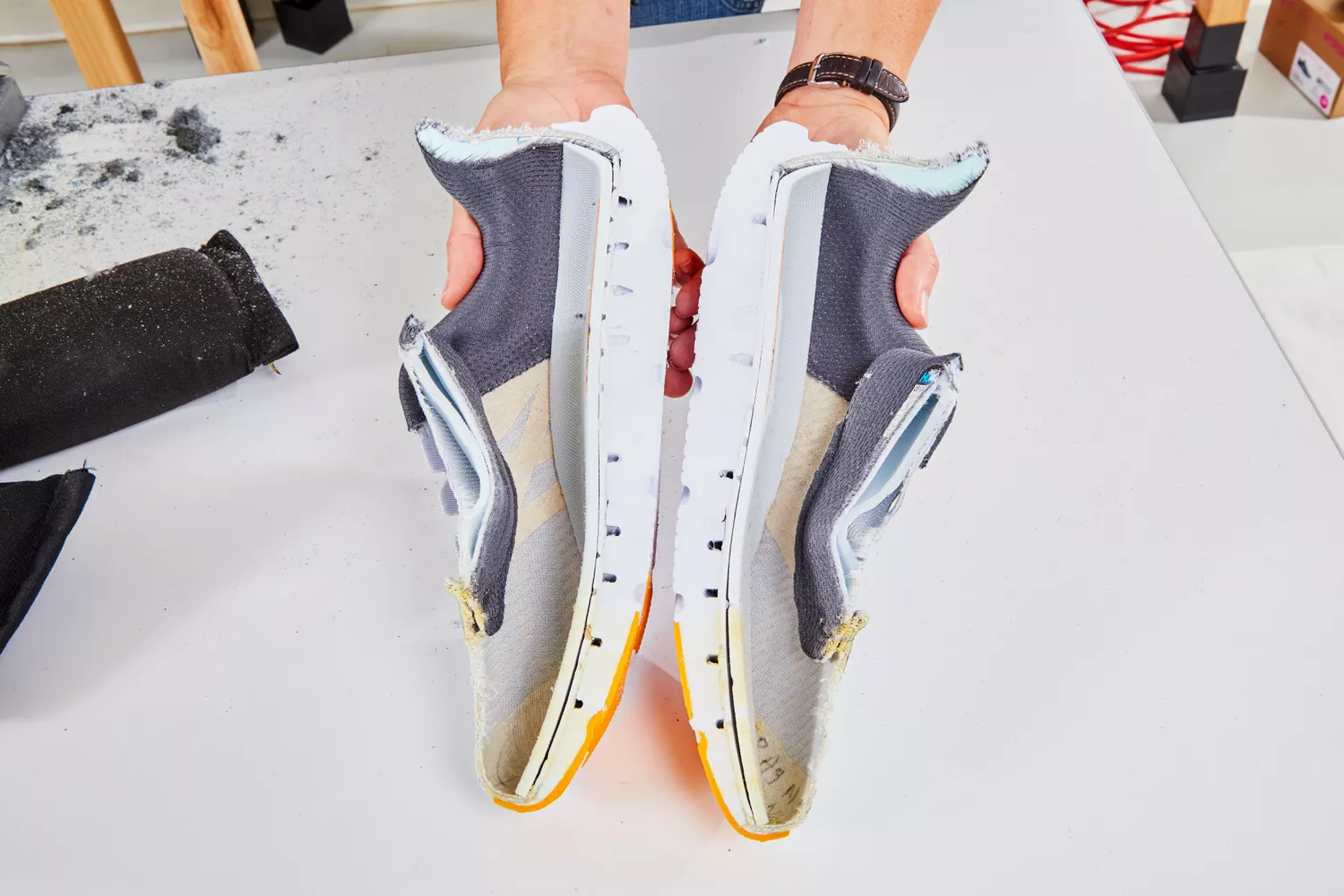 A cross-section of a running shoe showing the internal layers of cushioning and foam.