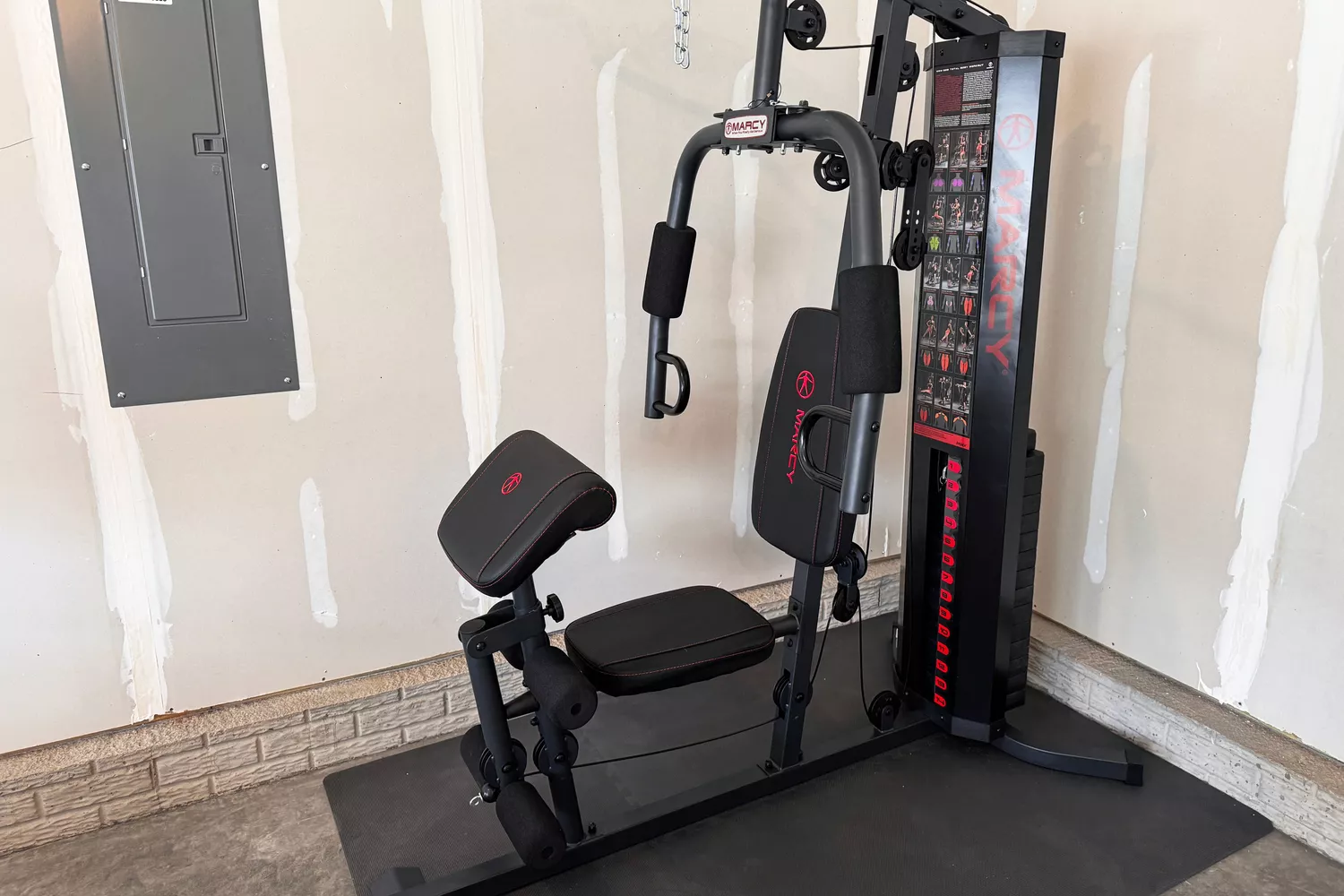 The Marcy MWM-989 multi-functional trainer with a 150lb weight stack in a garage gym.
