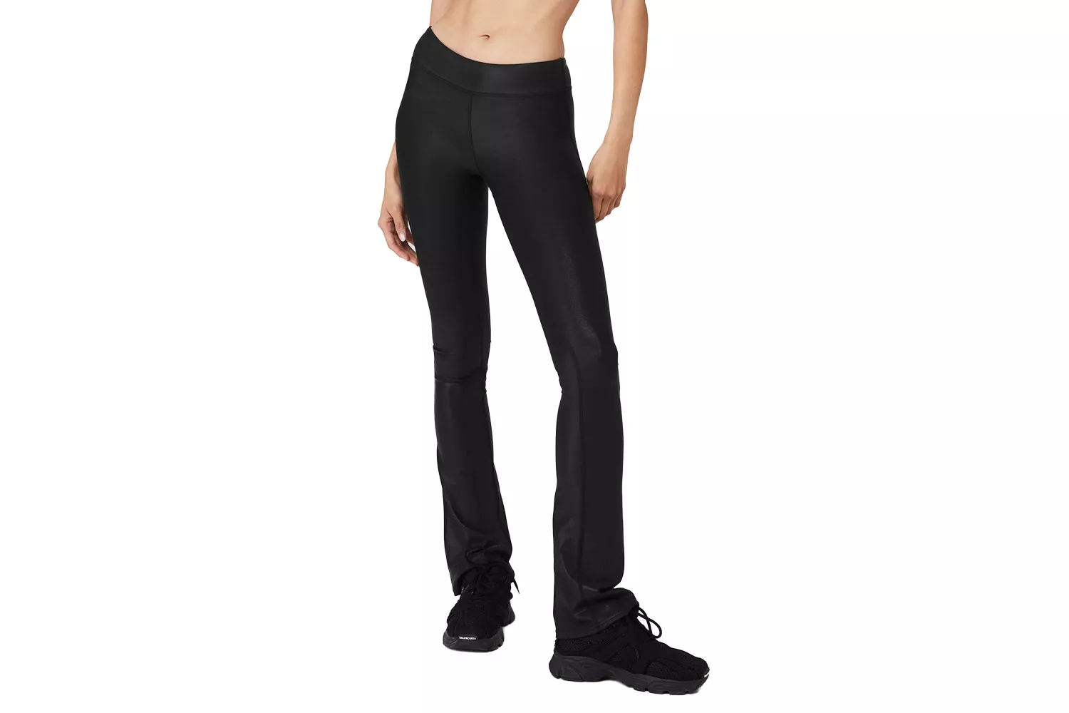 Close-up of black high-waisted leggings with a slight shimmery, compressive texture.