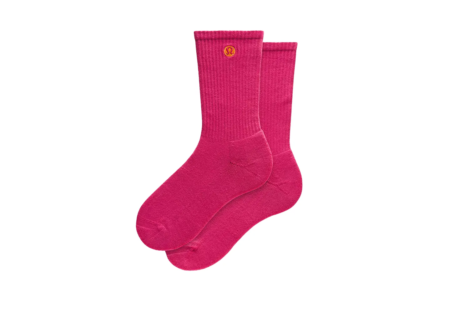 Pair of bright pink Lululemon crew socks displayed on a plain white background.