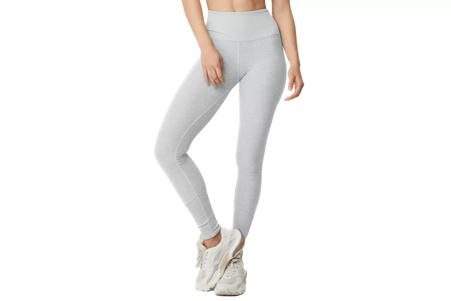 A woman modeling light gray high-waist leggings suitable for lounging or restorative yoga.