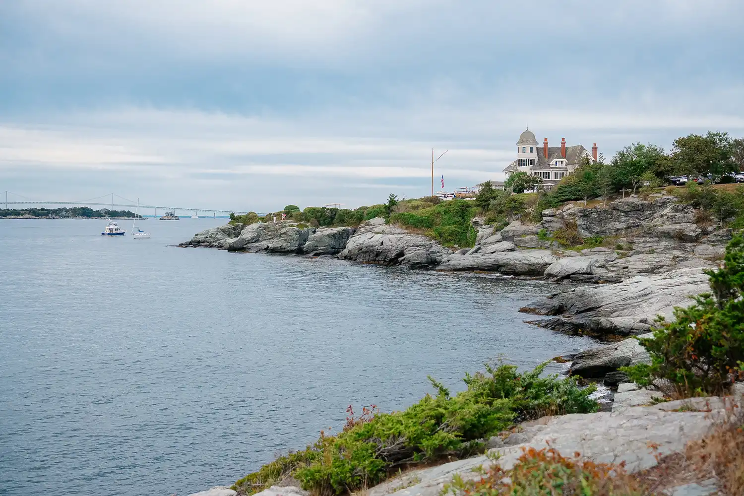 A historic mansion overlooking the ocean on the Newport Rhode Island coastline.