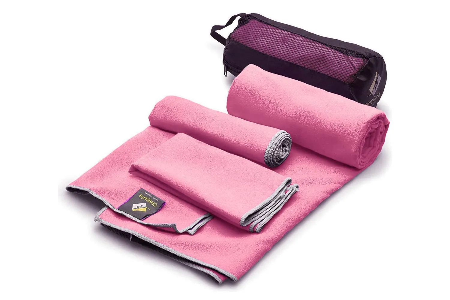 A set of pink OlimpiaFit quick-dry towels in different sizes with a mesh carry bag.
