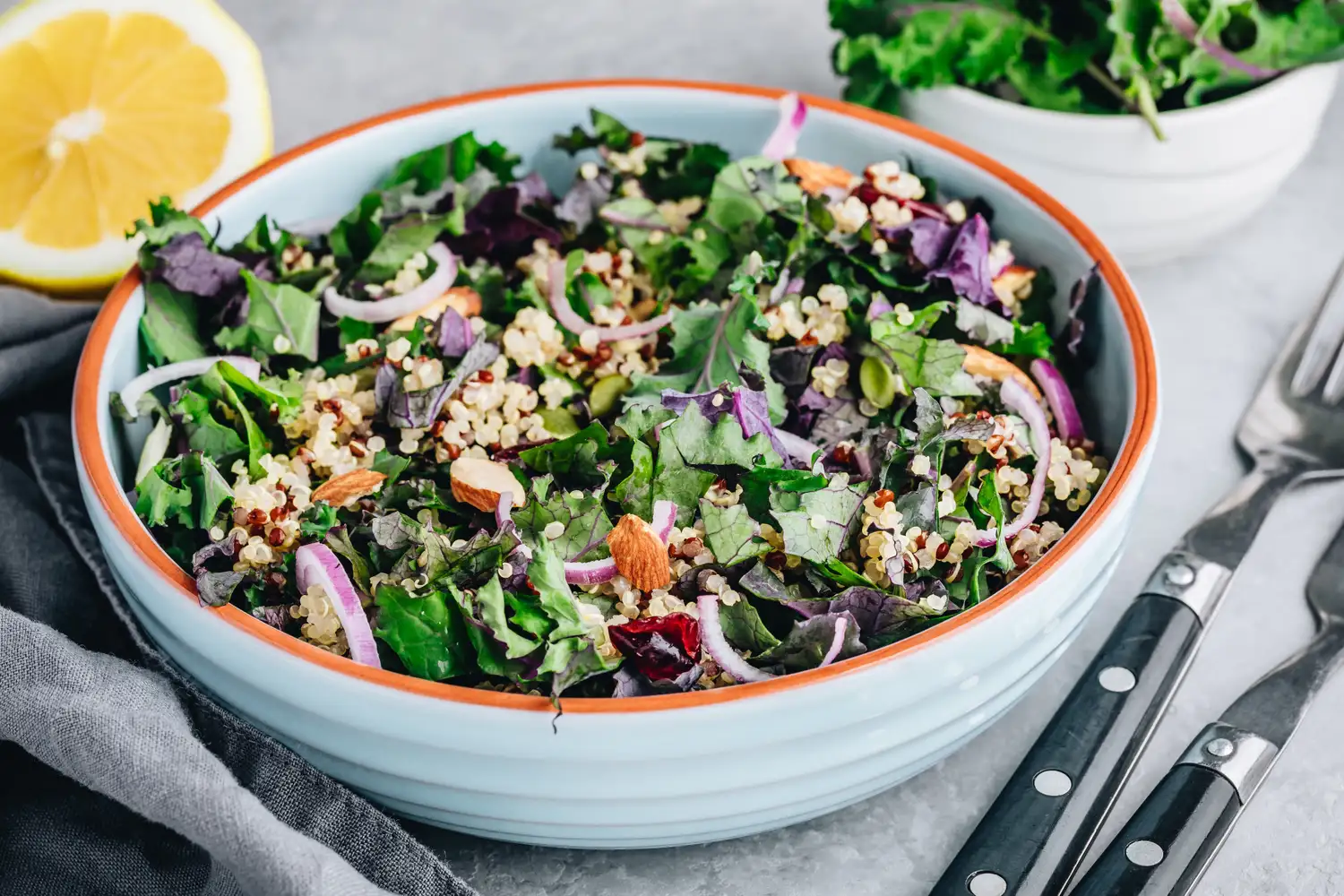 A grain bowl featuring greens and quinoa.